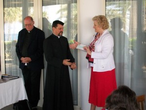 Mrs Joy Shefford presenting Fr. Carlos Ferrera with a cheque for 800 Euros